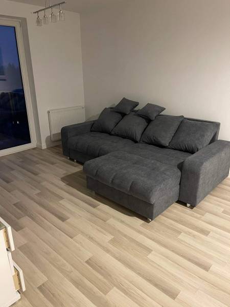 Narożnik z funkcja spania i schowkiem na pościel 